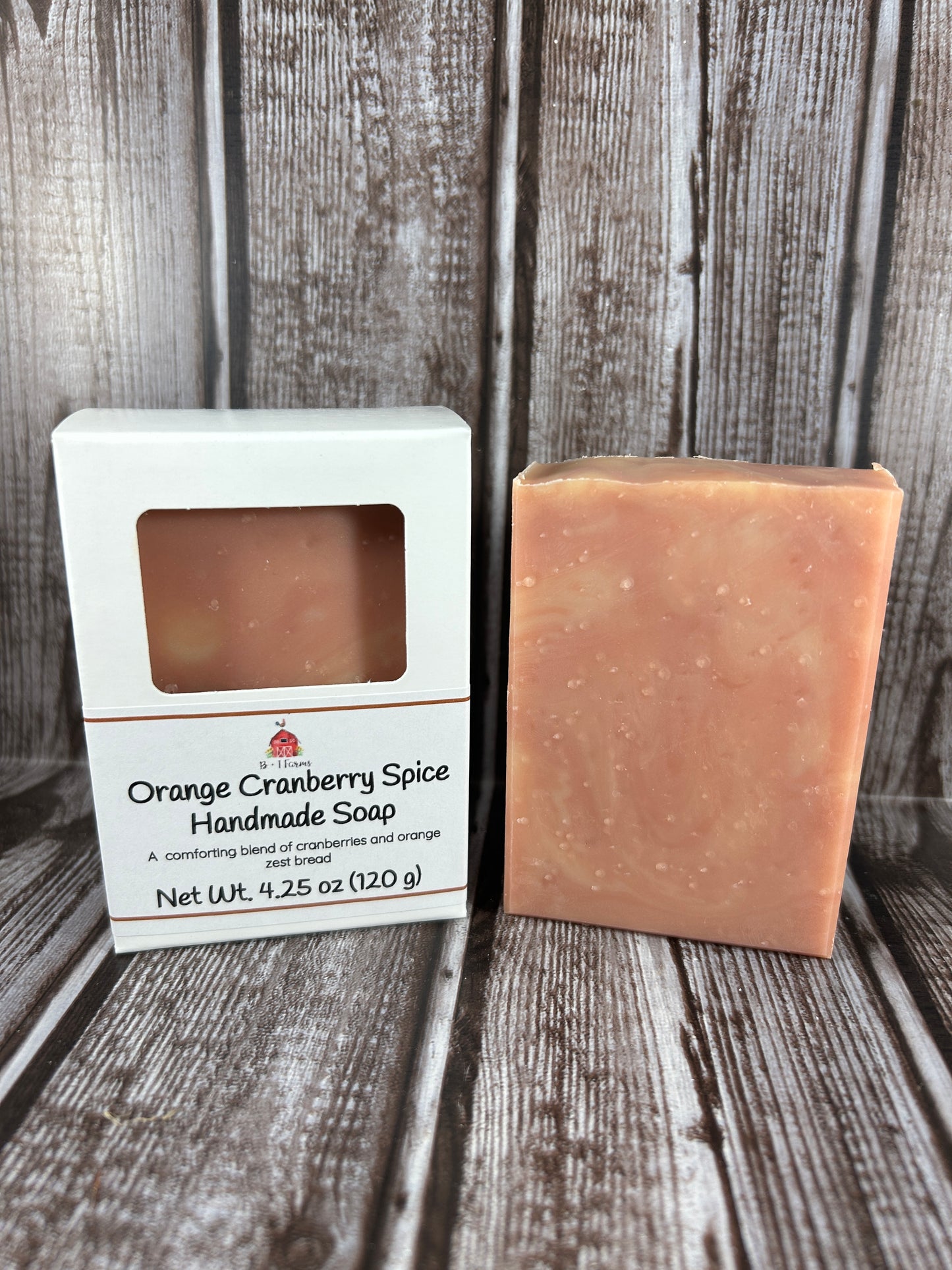 Bar of soap with packaging on a wooden surface