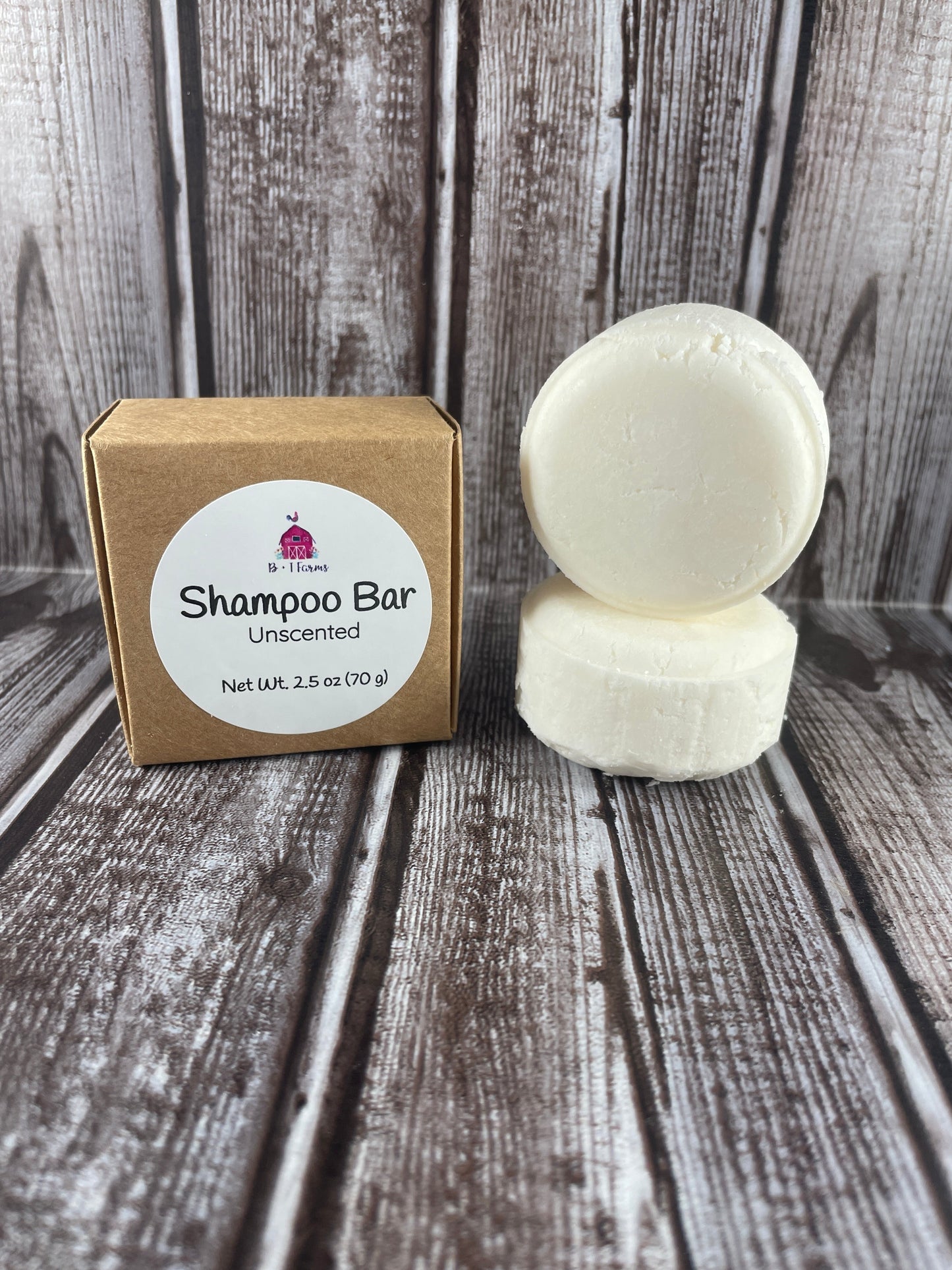 Unscented shampoo bar with packaging on a wooden surface