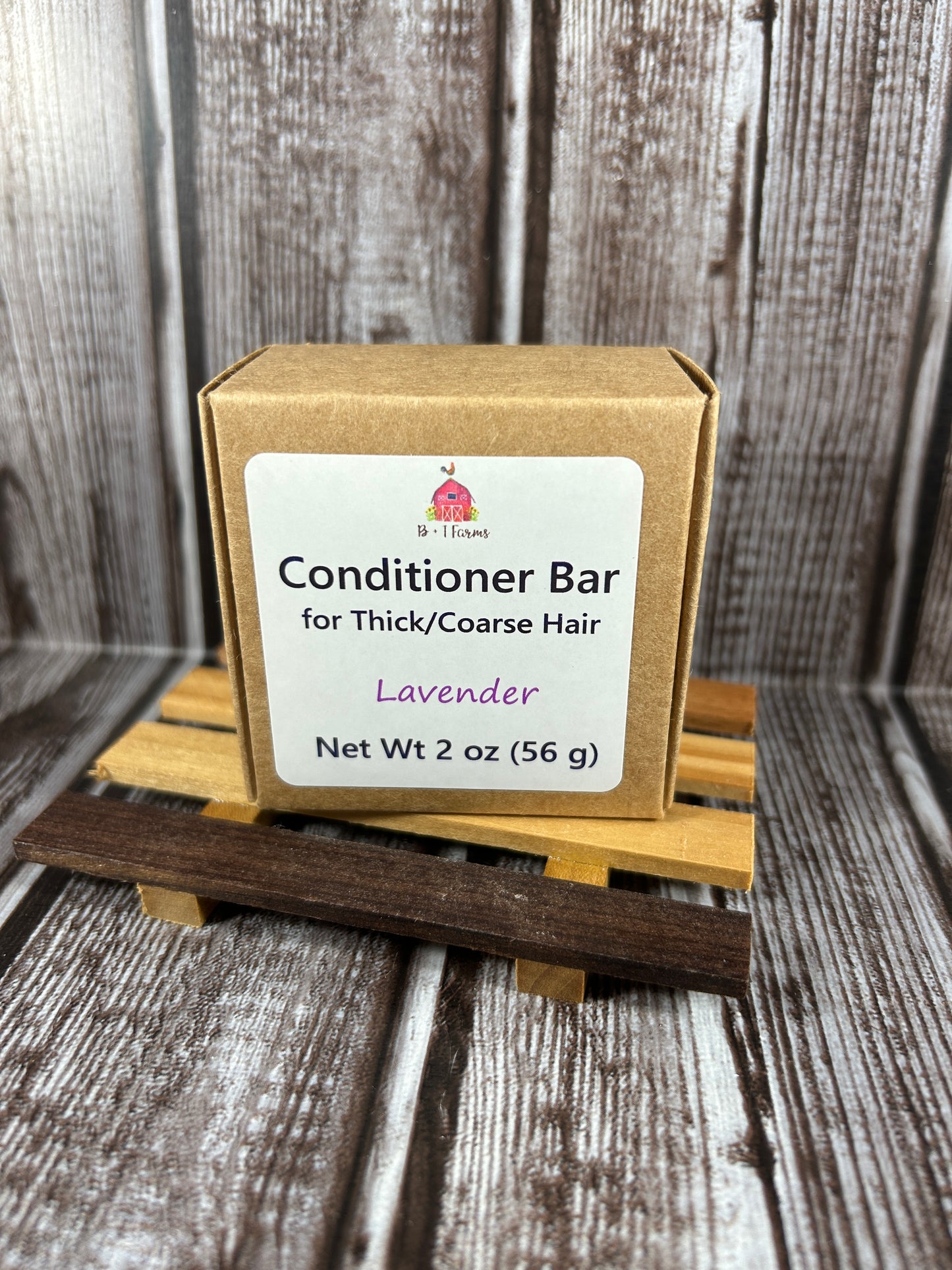 Conditioner bar with a wooden handle on a rustic wooden background