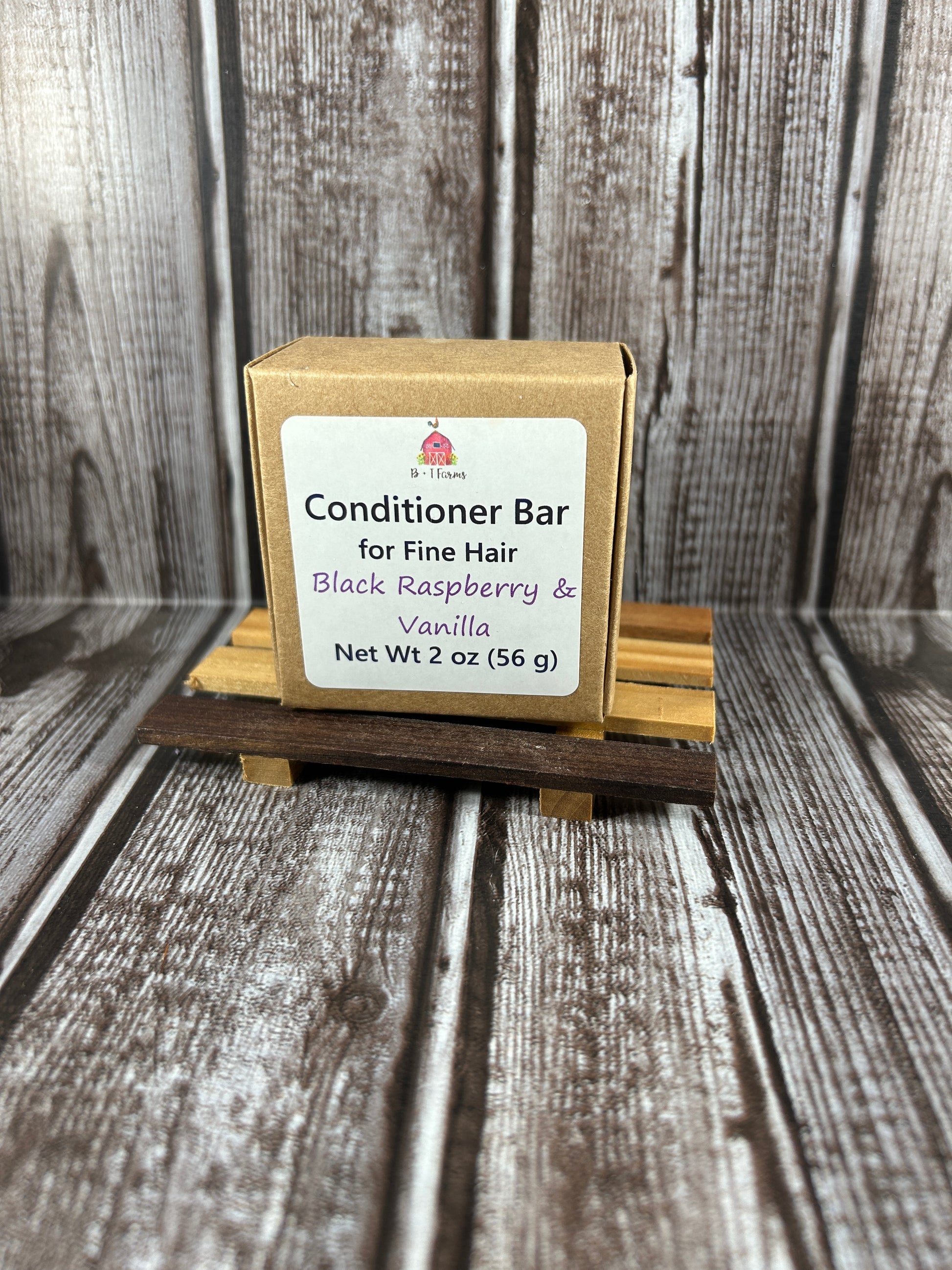 Conditioner bar packaging on a wooden background