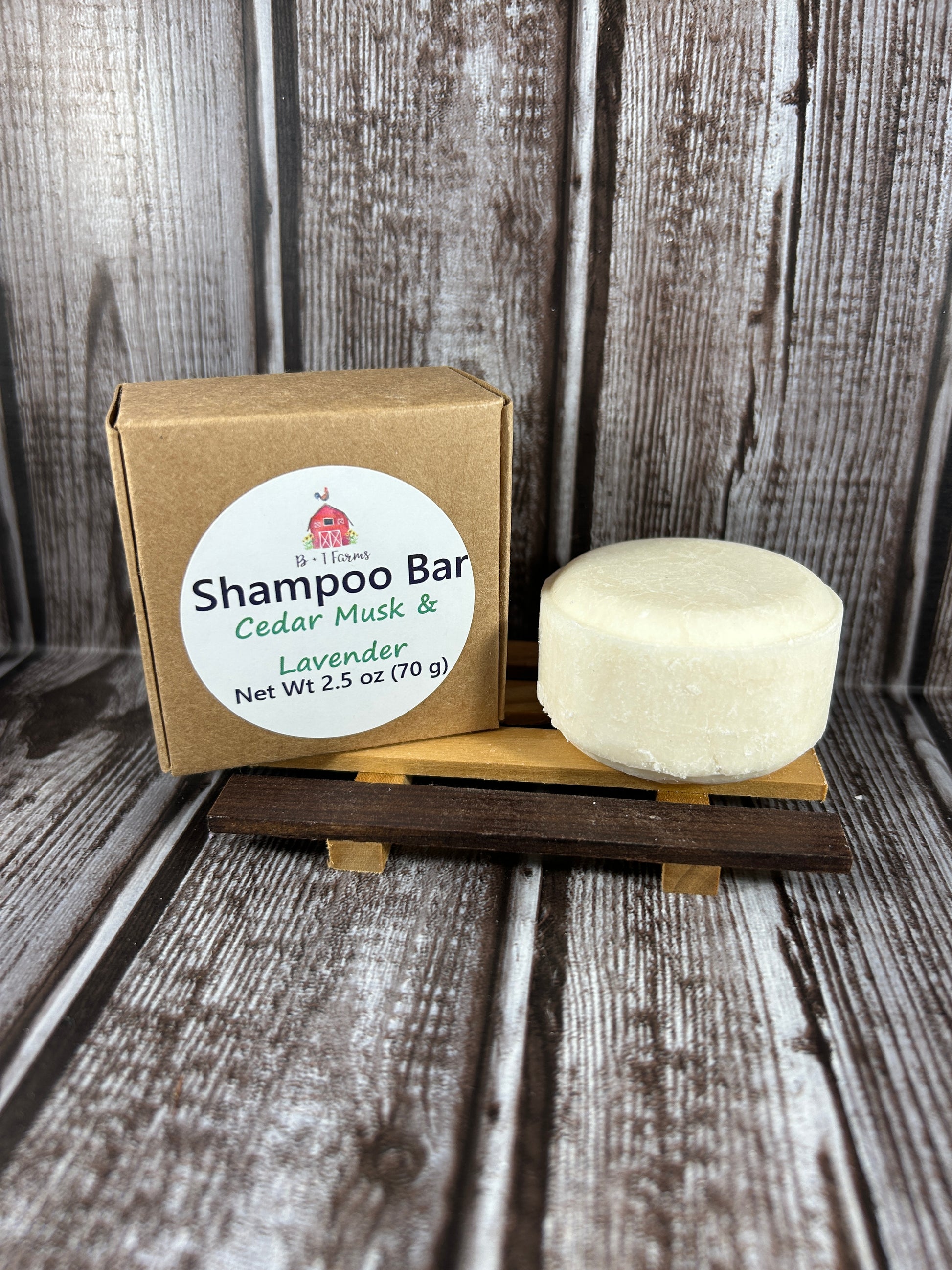 Shampoo bar on a wooden stand with a cardboard box labeled 'Shampoo Bar' on a rustic wooden background.