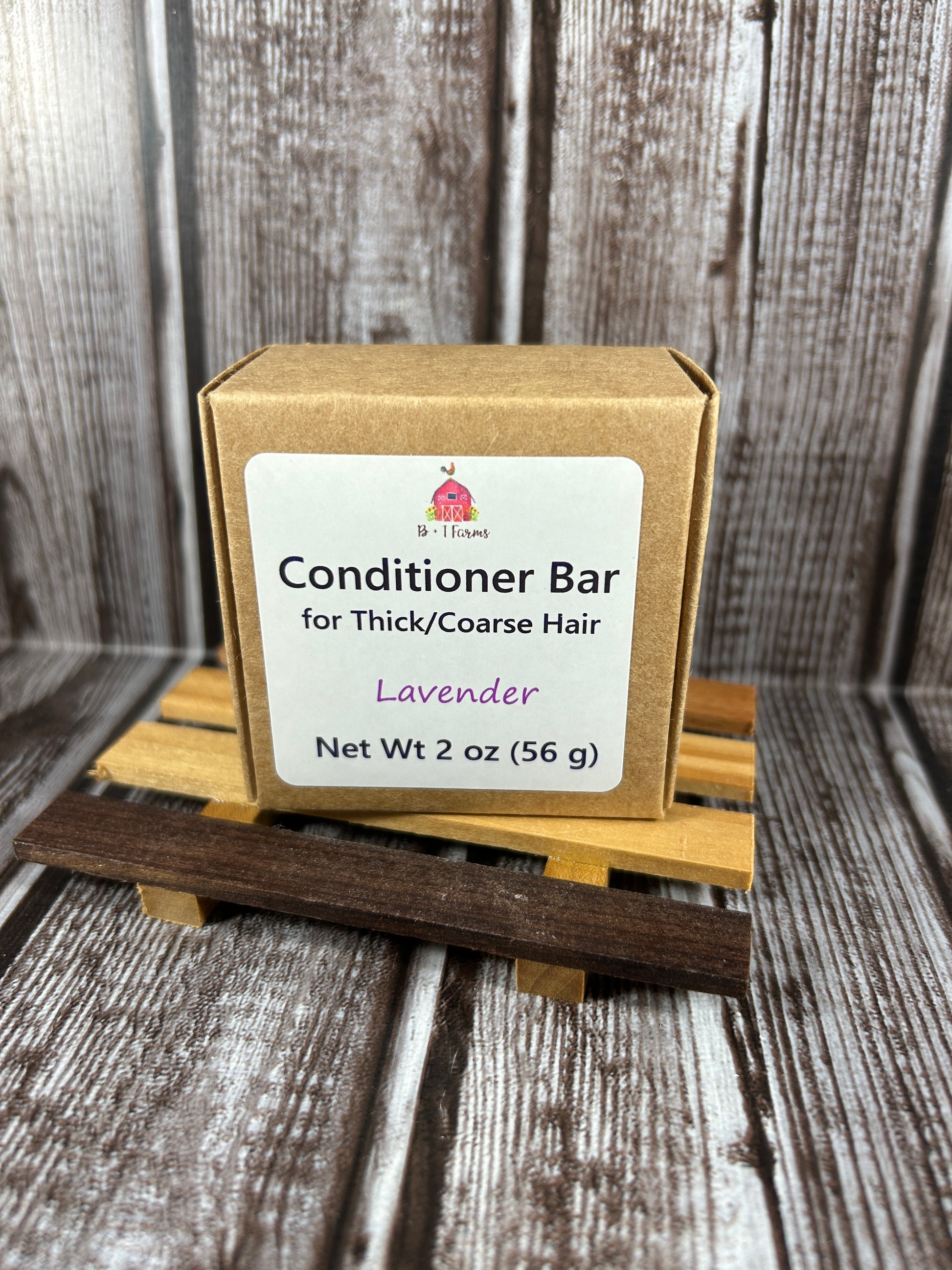 Conditioner bar with a wooden handle on a rustic wooden background