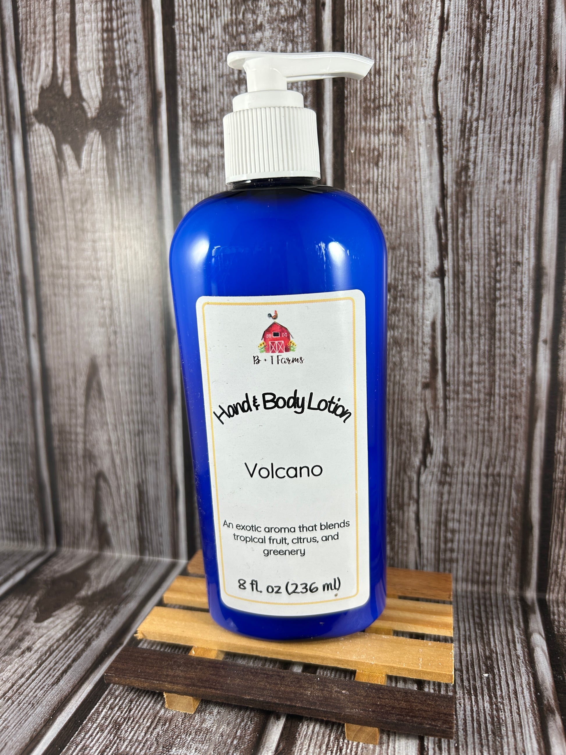 Hand and body lotion bottle on a wooden surface. Scent is called Volcano