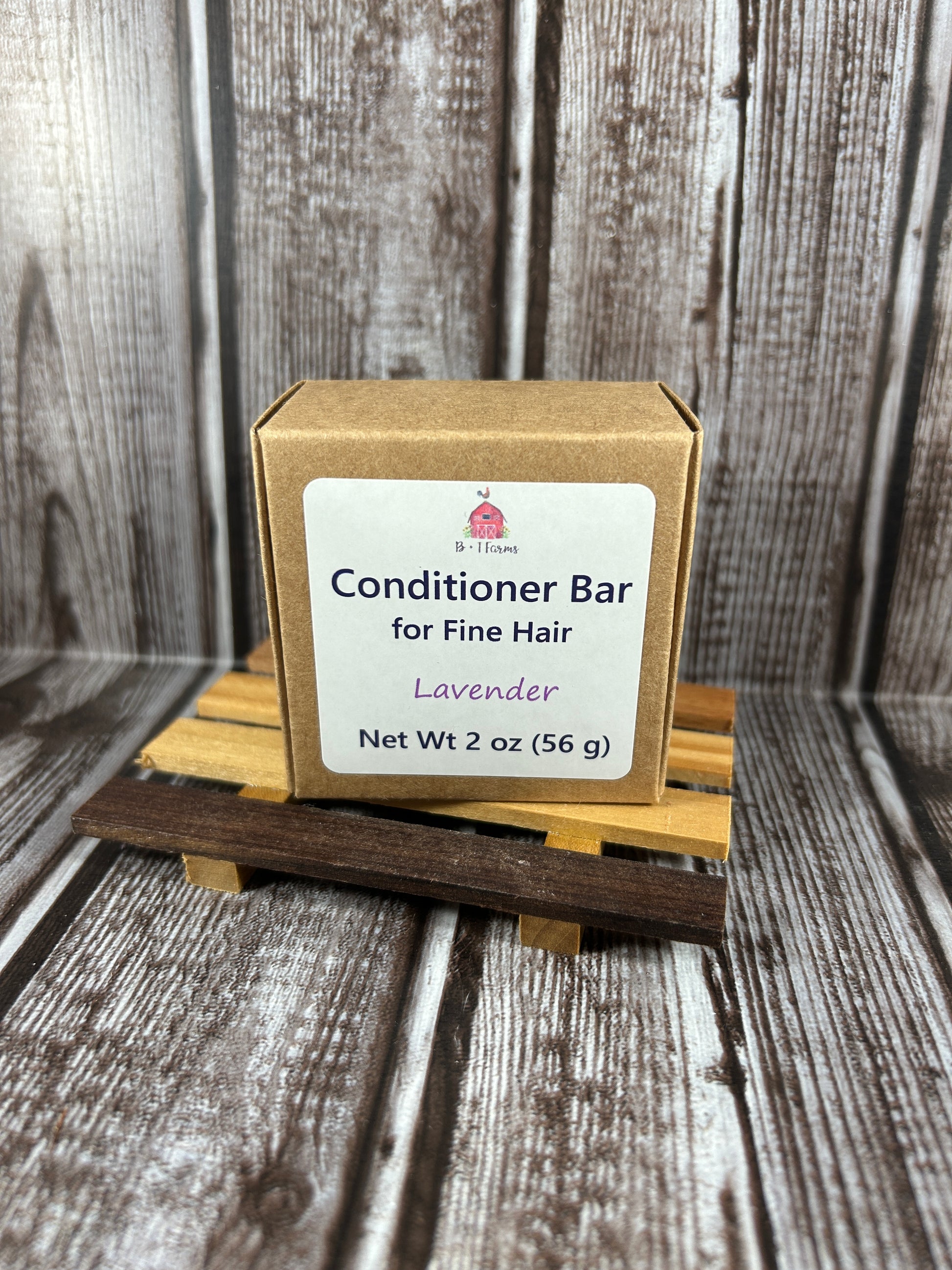 Conditioner bar with packaging on a wooden background
