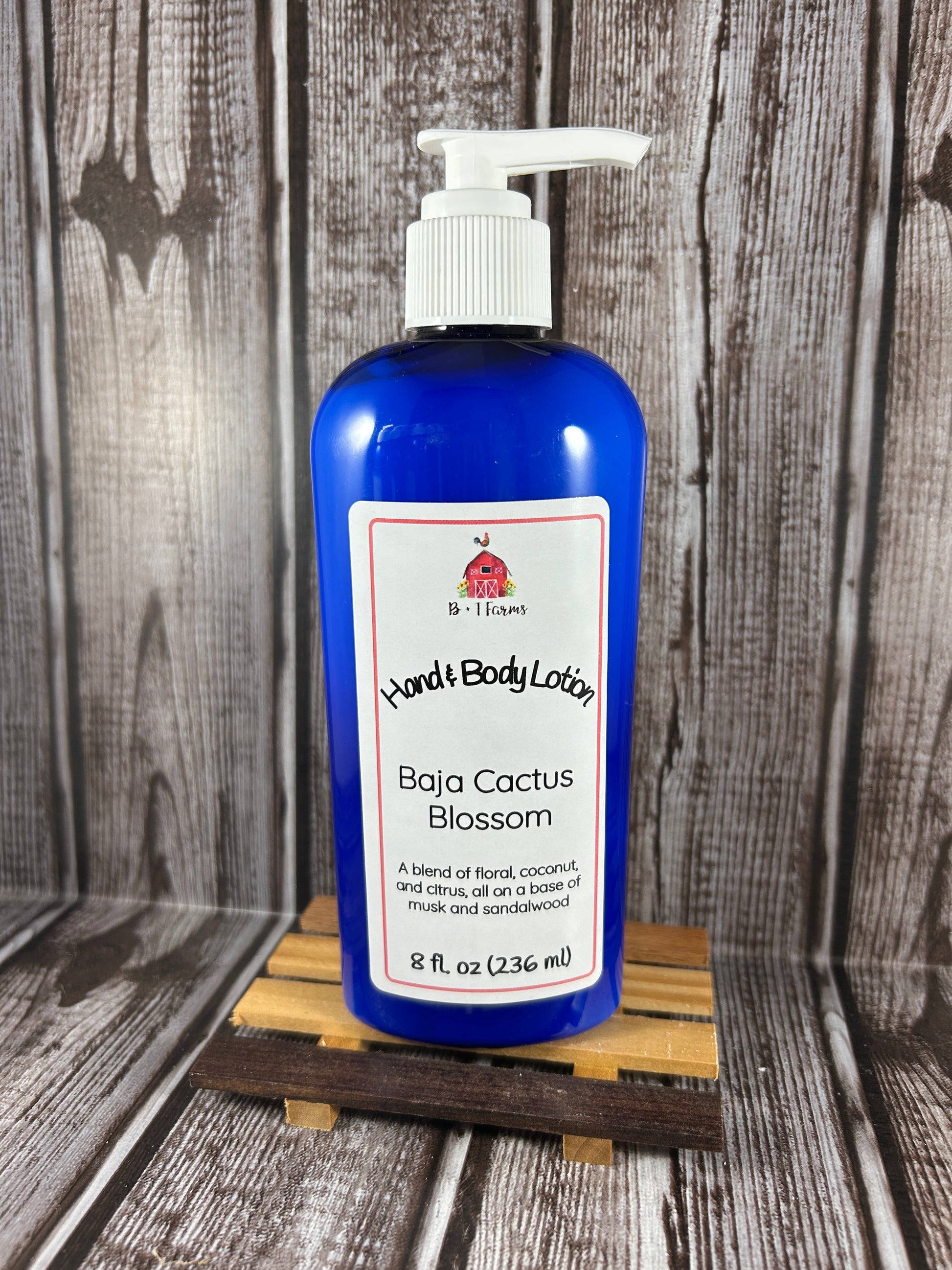 Hand and body lotion bottle on a wooden surface. Scent is called Baja Cactus Blossom